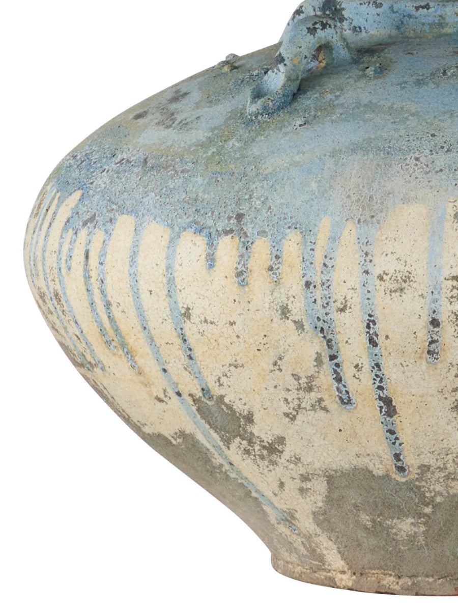 Handcrafted terracotta table lamp with pale ivory finish and antique blue drip glaze, featuring a large jar-shaped base and empire shade.