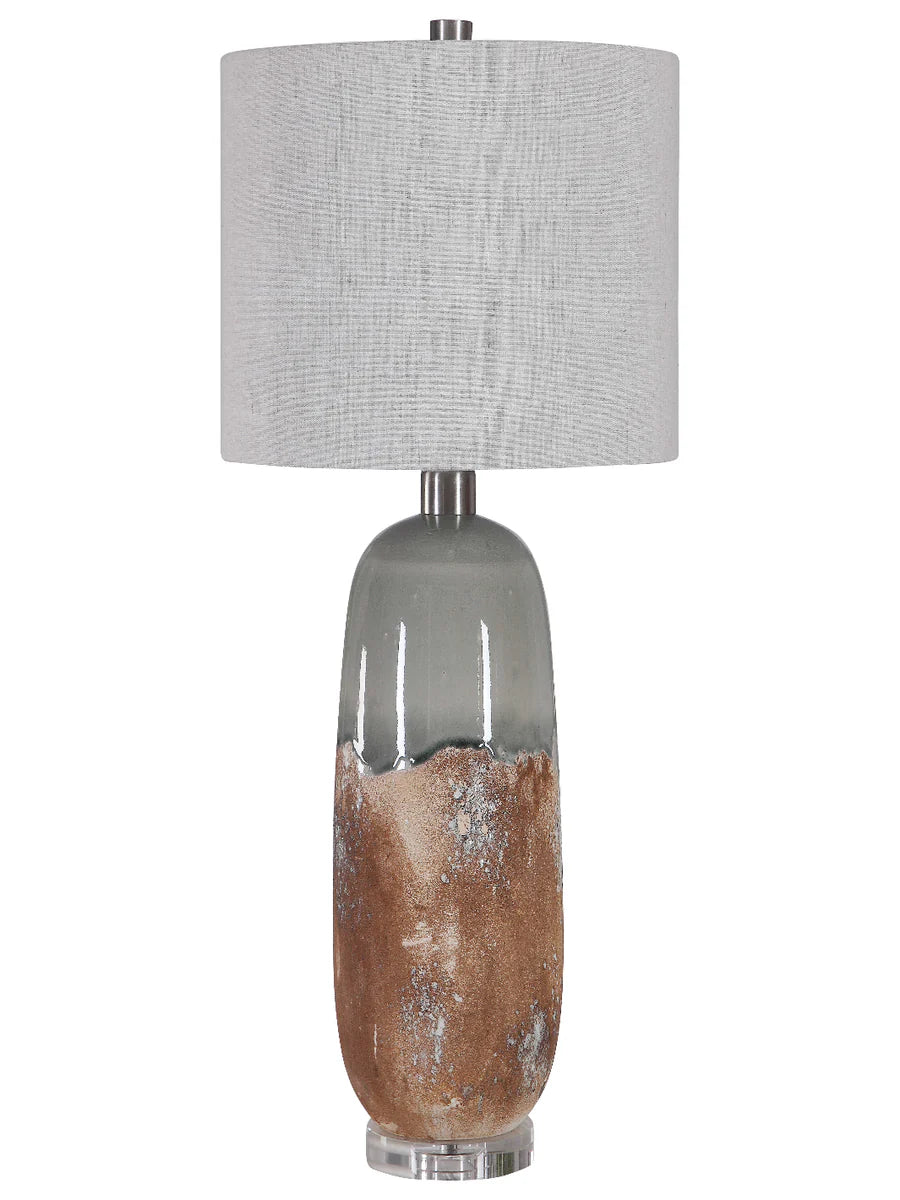 Table lamp with a textured gray shade and a base with natural wood finish on a white background